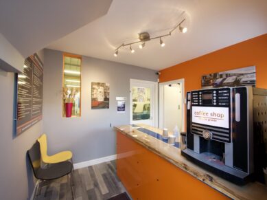Customer waiting area with a coffee machine