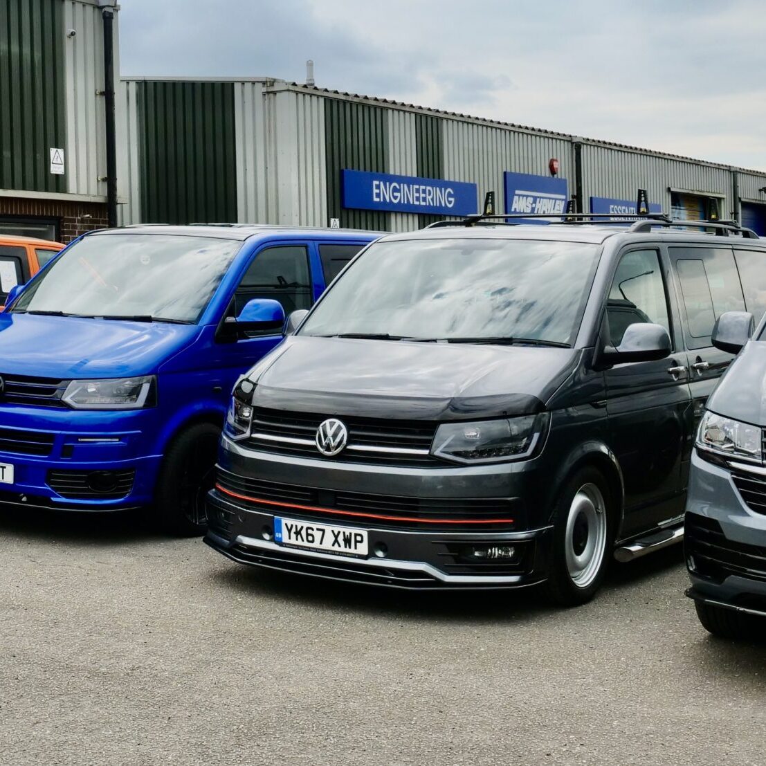 Volkswagen vans lined up outside Clements Bodyshop, Somercotes
