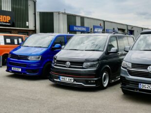 Volkswagen vans lined up outside Clements Bodyshop, Somercotes